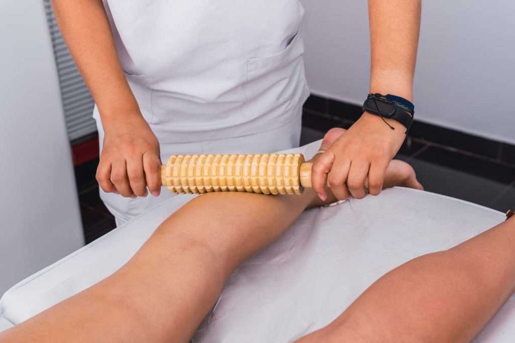 beautician giving a calf massage to a woman with a 2023 11 27 05 23 56 utc